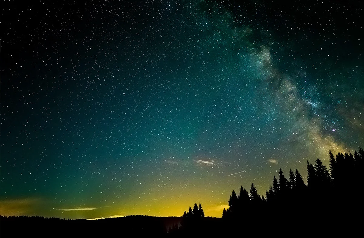 meteor shower over Czech landscape night sky