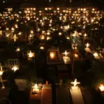 Filipino ghost month festival celebration night candles cemetery
