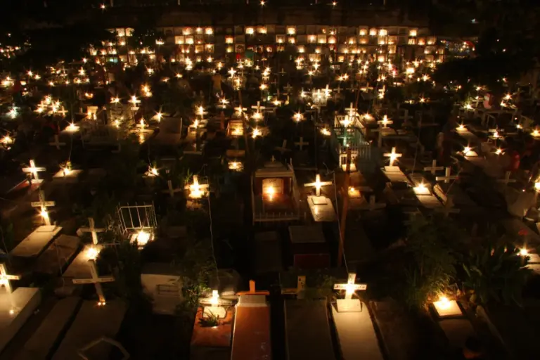 Filipino ghost month festival celebration night candles cemetery