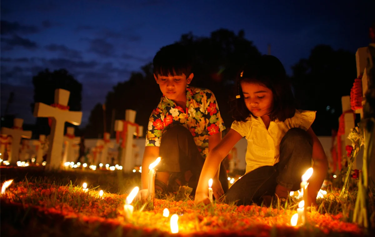 Filipino ghost month festival celebration night candles cemetery