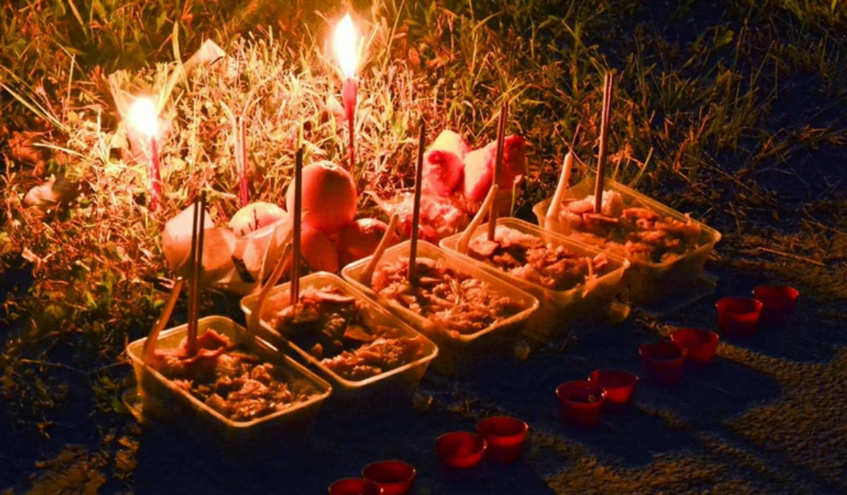 Philippines festival family graveyard celebration food offerings night