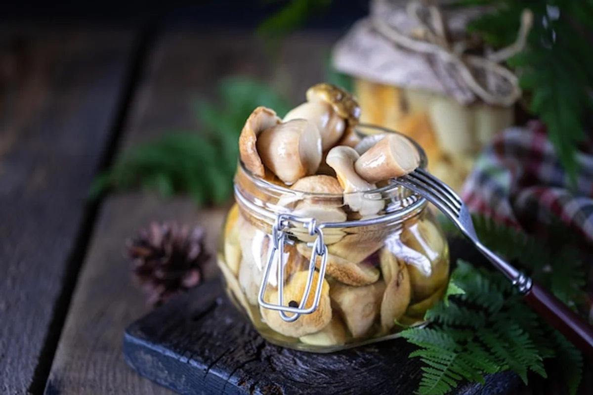 homemade pickled mushrooms in a jar autumn style