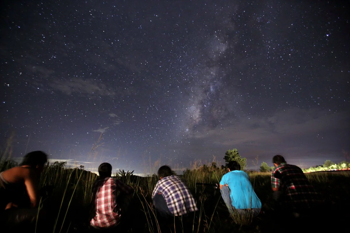 friends watching meteor shower meadow czech republic night safety
