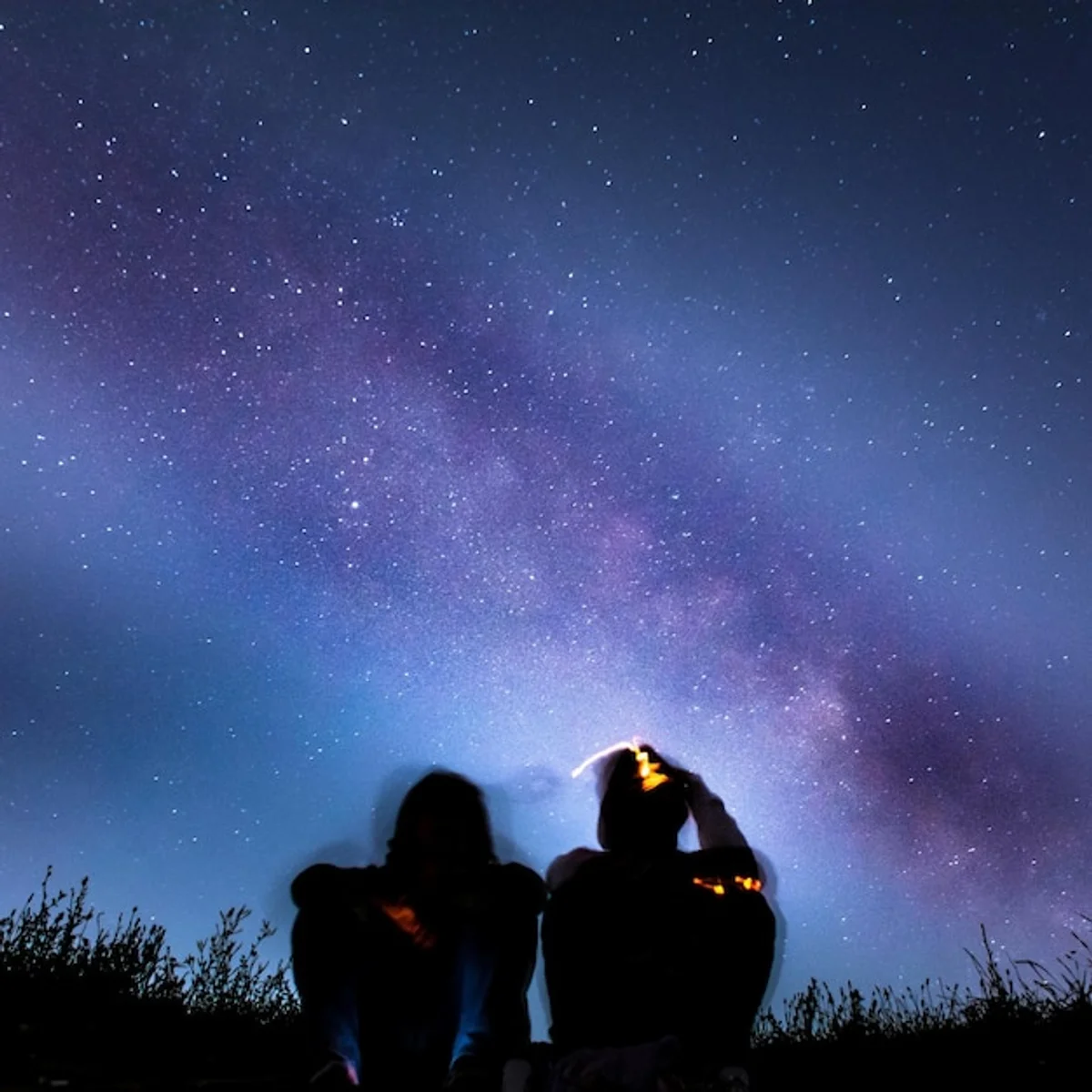 people observing night sky at European observatory