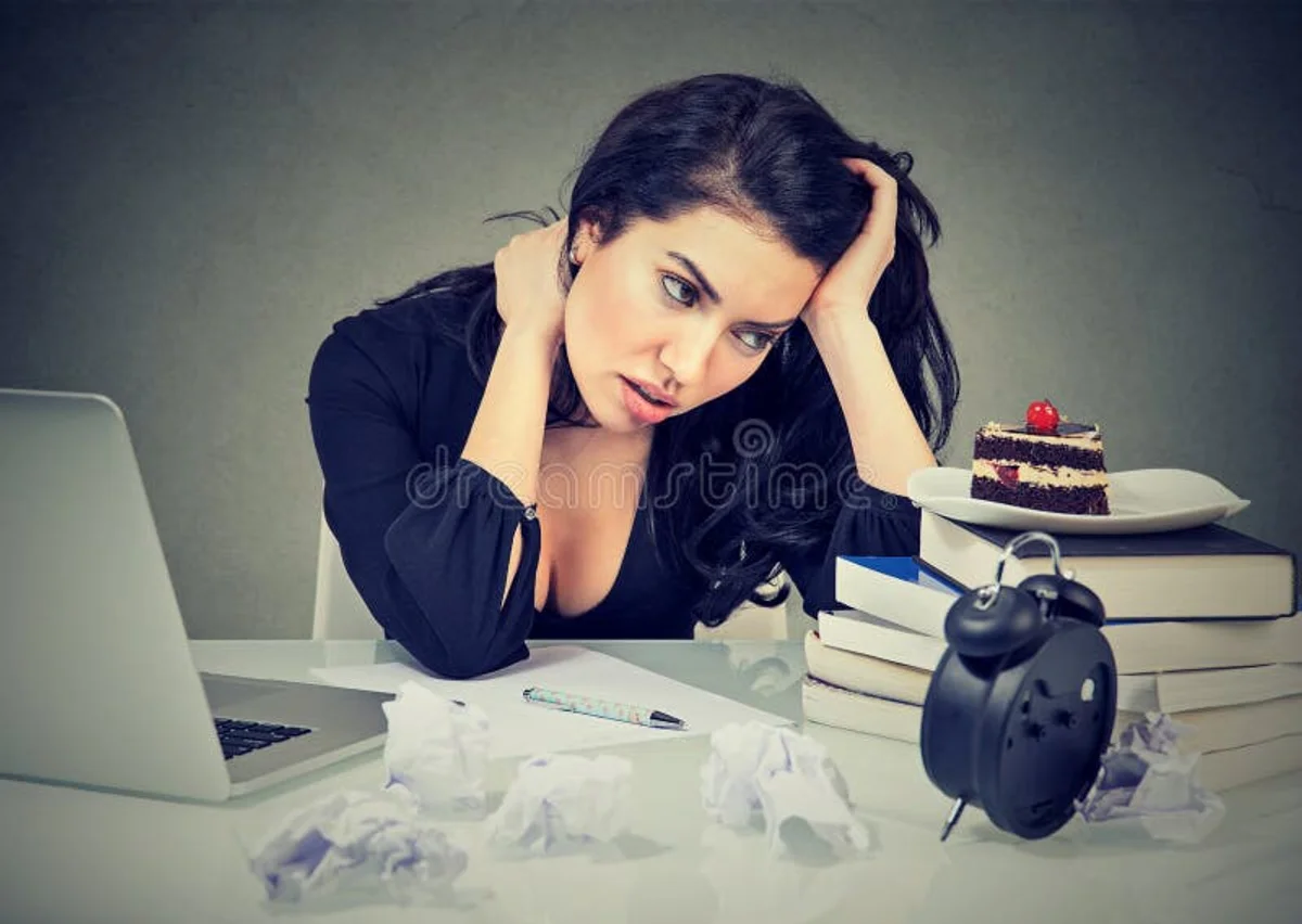 stressed person craving sweets office Czech