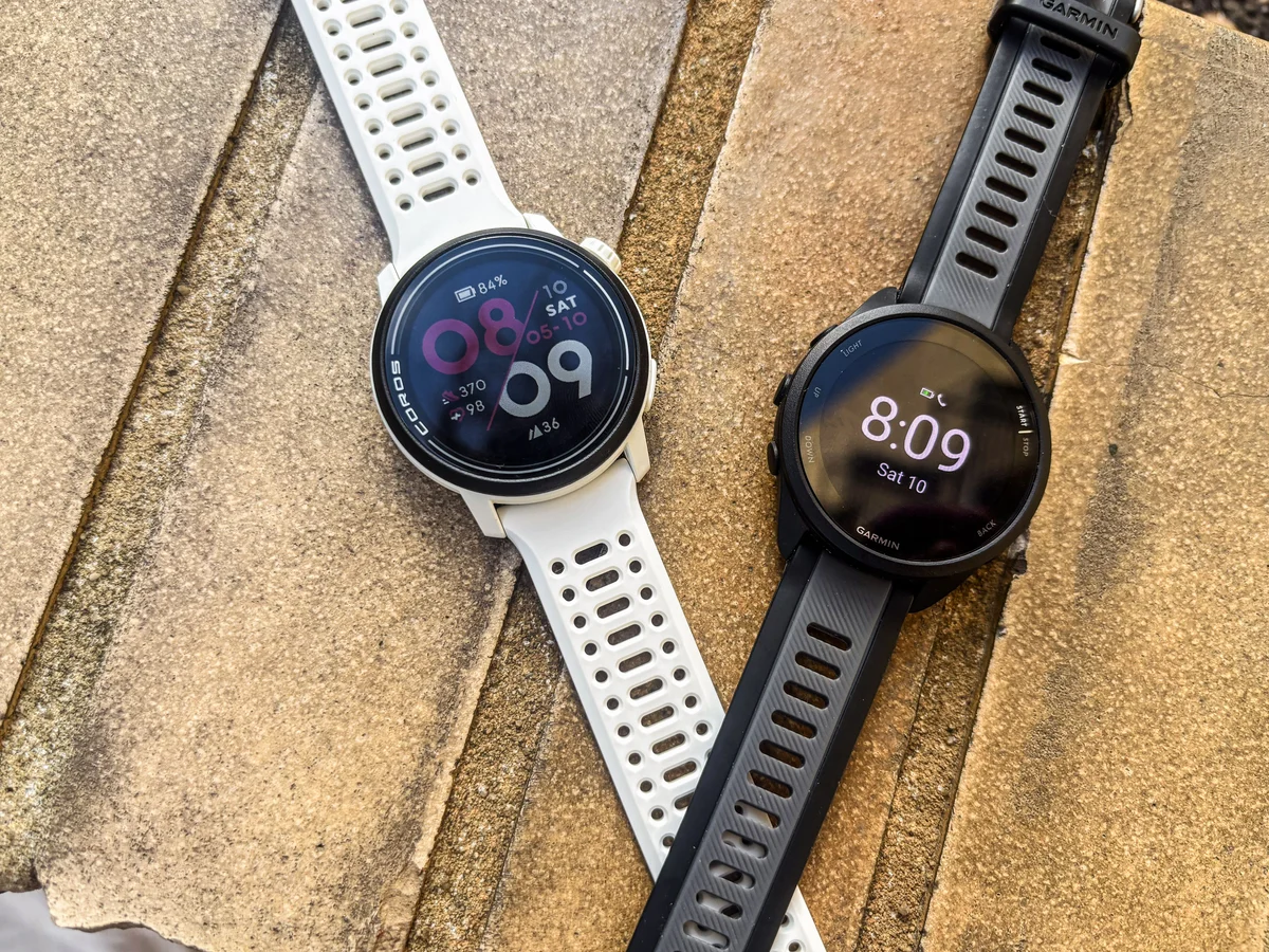 runner reviewing smartwatch kilometers autumn marathon