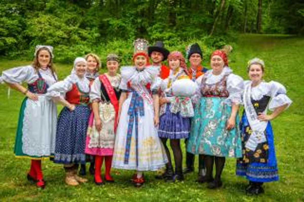 czech folklore festival traditional costumes modern city contrast