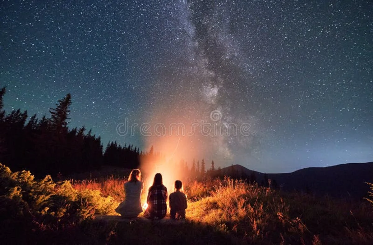 family stargazing autumn meadow Czech Republic