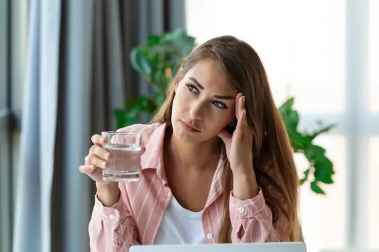 relieved person after drinking water headache office