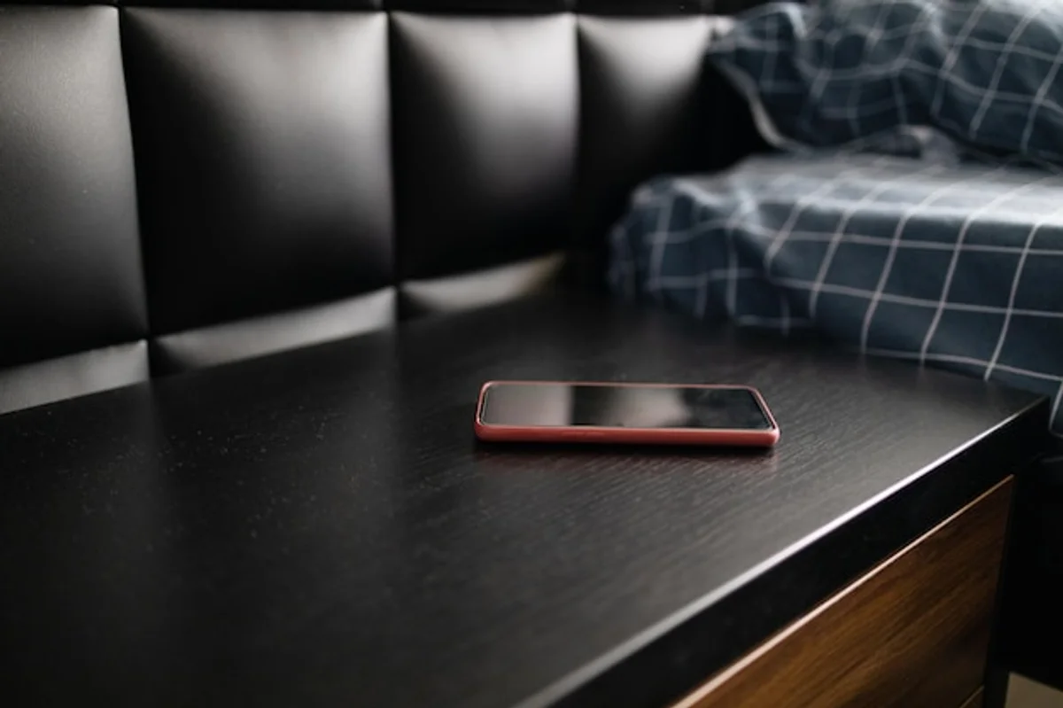 sleep mode mobile phone on night table