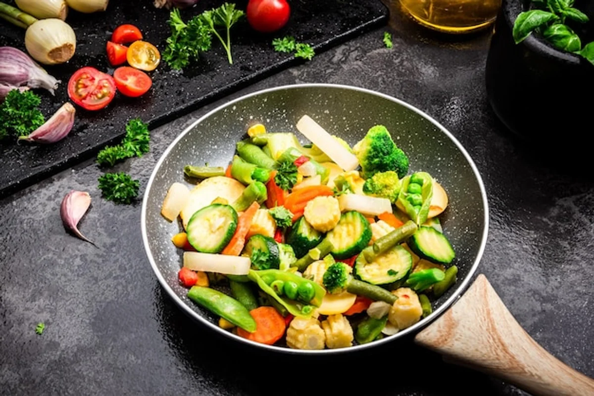 crispy vegetables in pan close-up