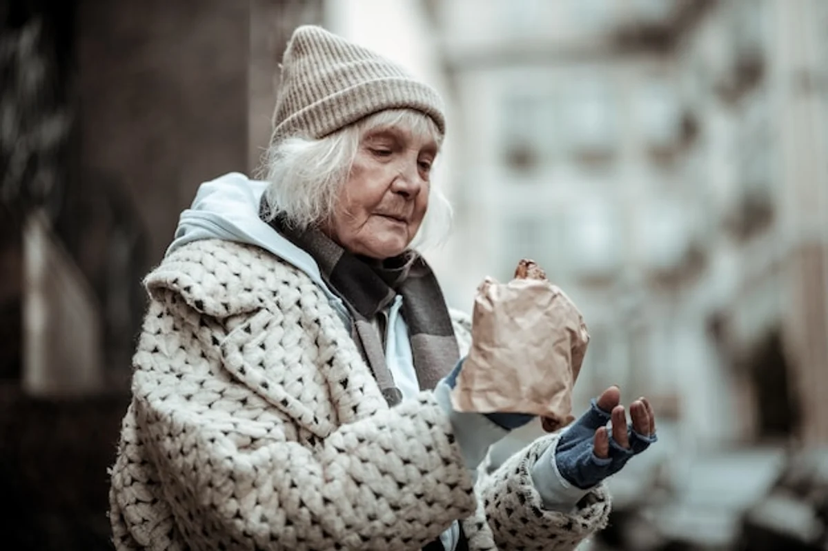 sad woman eating in winter