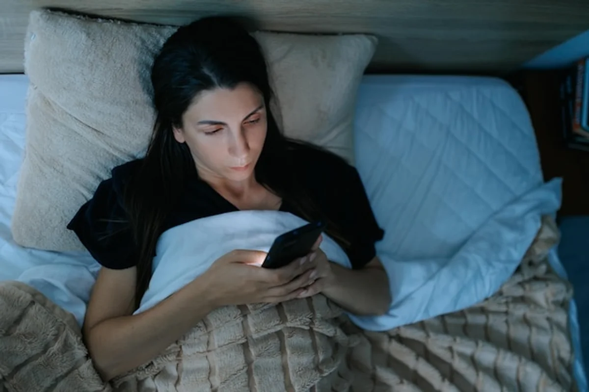 woman insomnia smartphone night