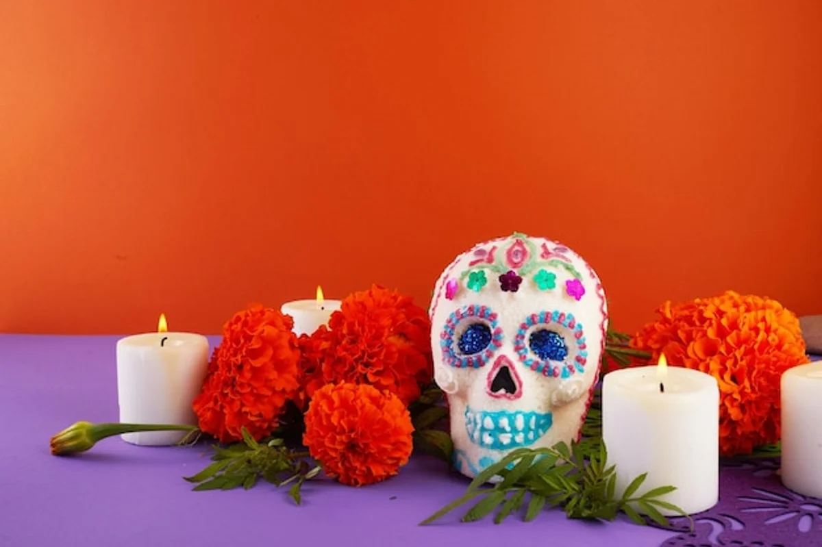 homemade Day of the Dead altar with candles and photos
