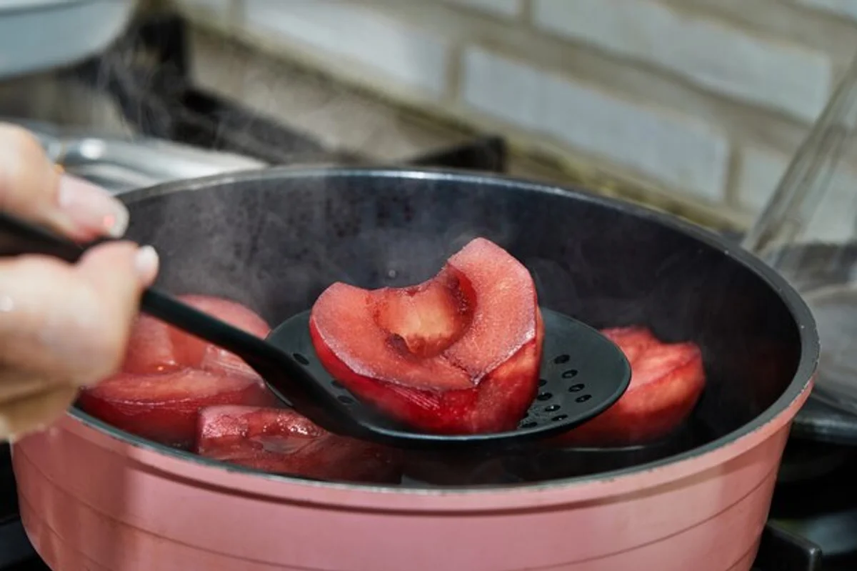 making fruit syrup in kitchen