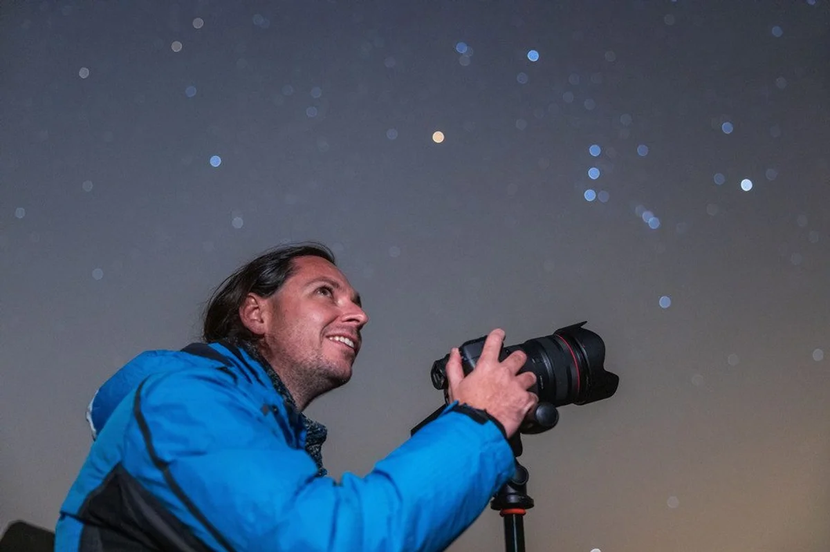 people stargazing on autumn field czech republic