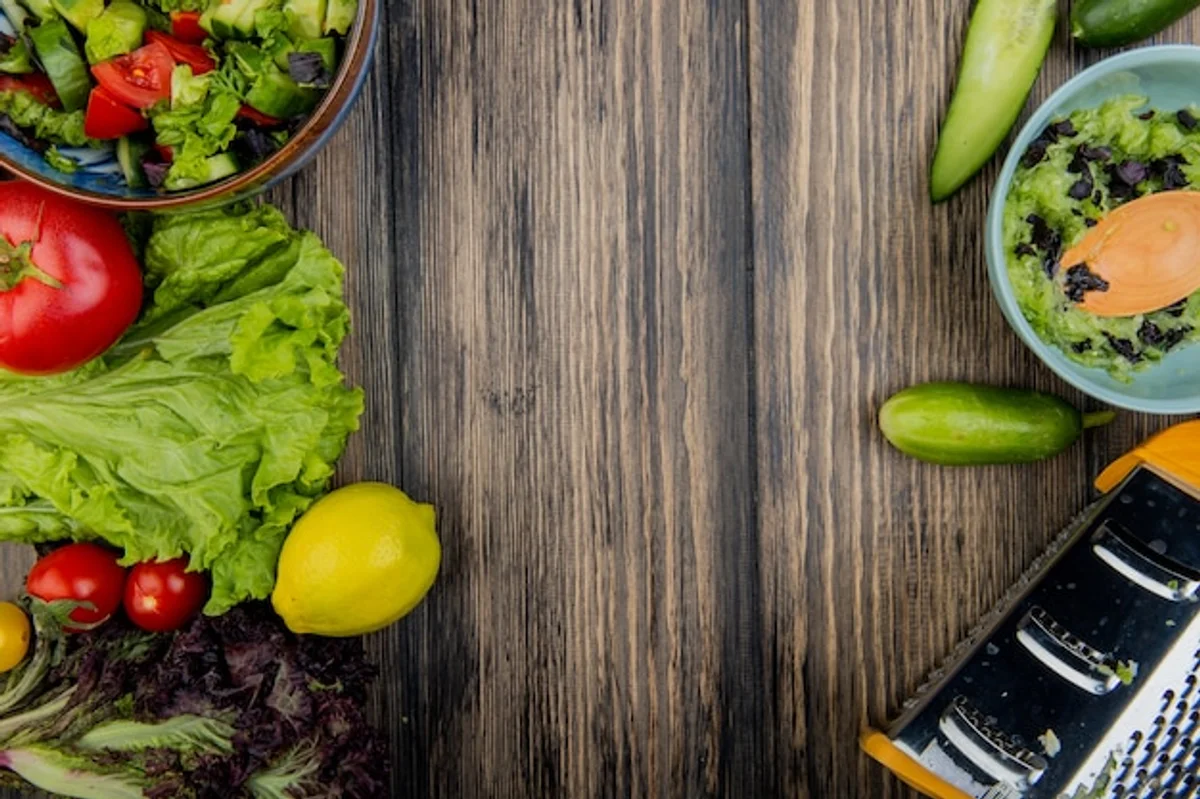 fresh autumn salad with lemon slice on wooden table