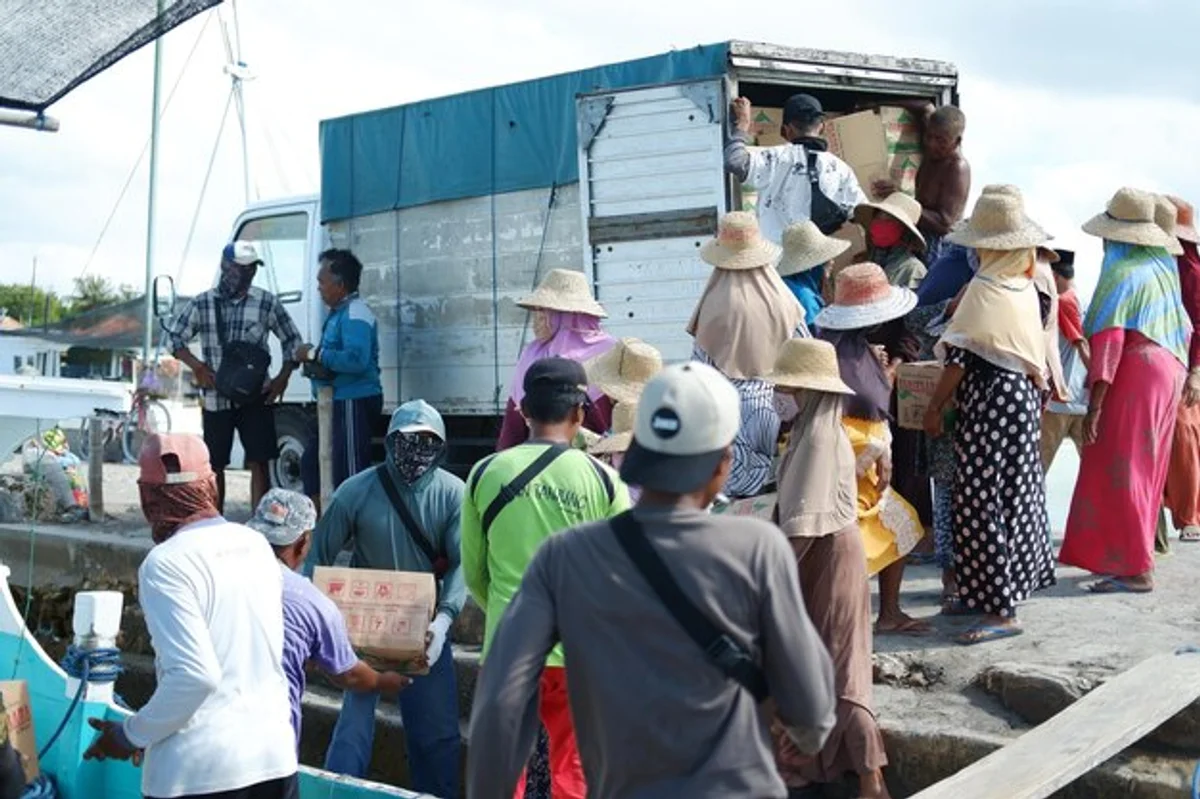 indonesian village community teamwork outdoors