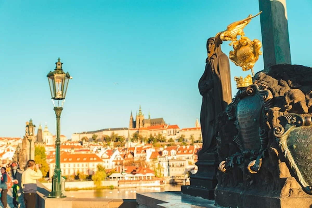 man walking in Prague morning sunlight