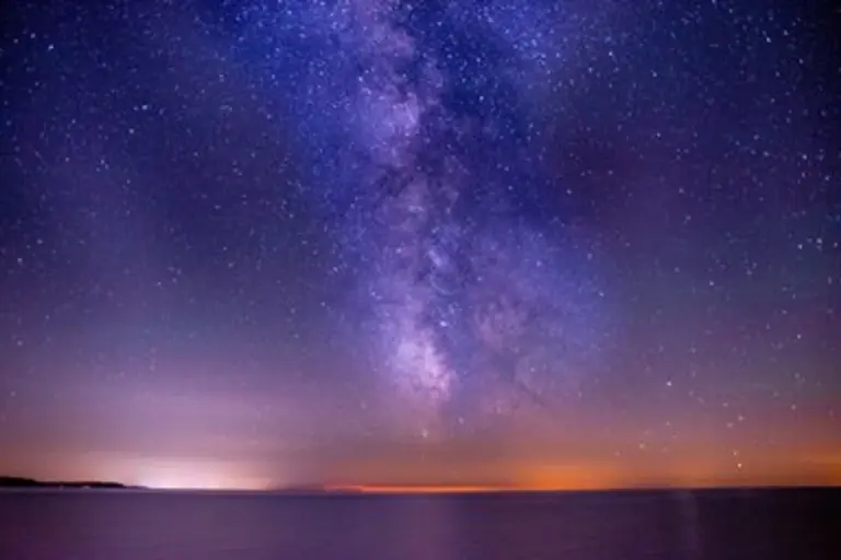 people using mobile app to view stars milky way night sky