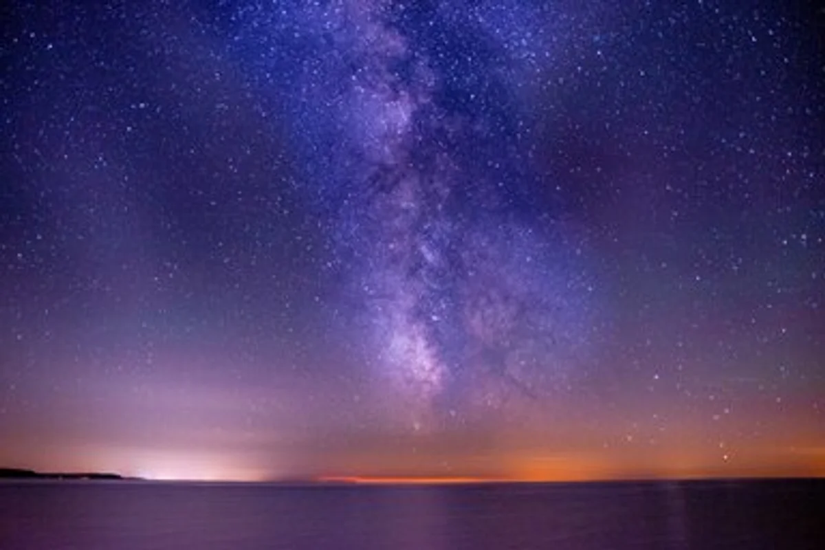 people using mobile app to view stars milky way night sky