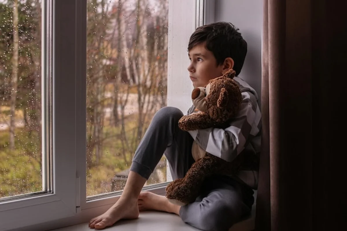 depressed person autumn rain window comfort