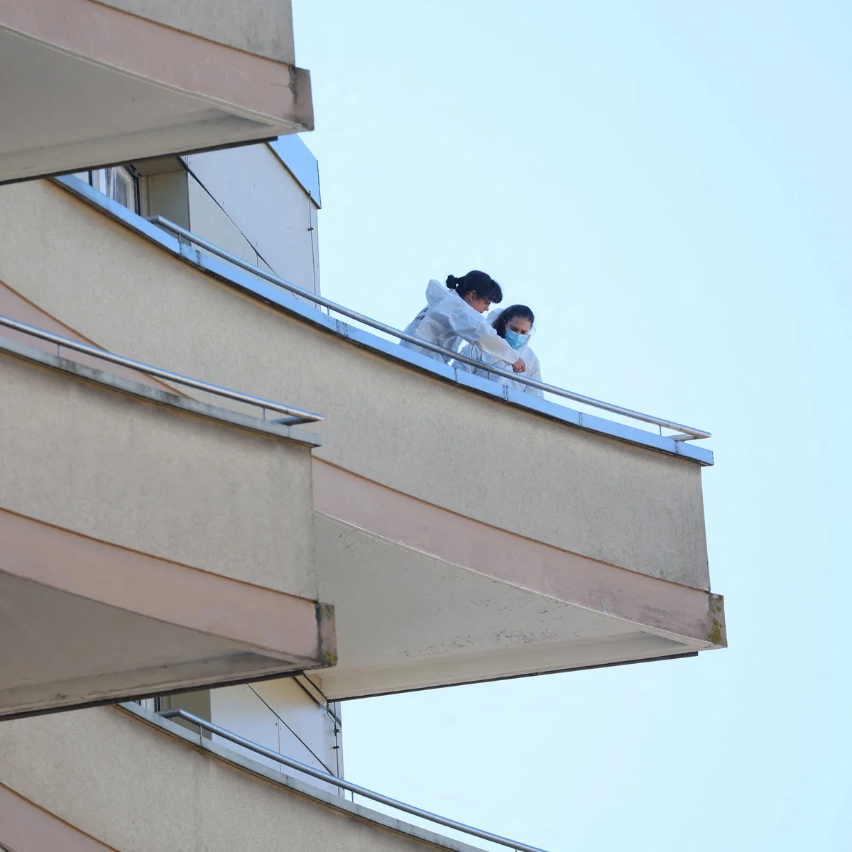 family watching comet from balcony czech city