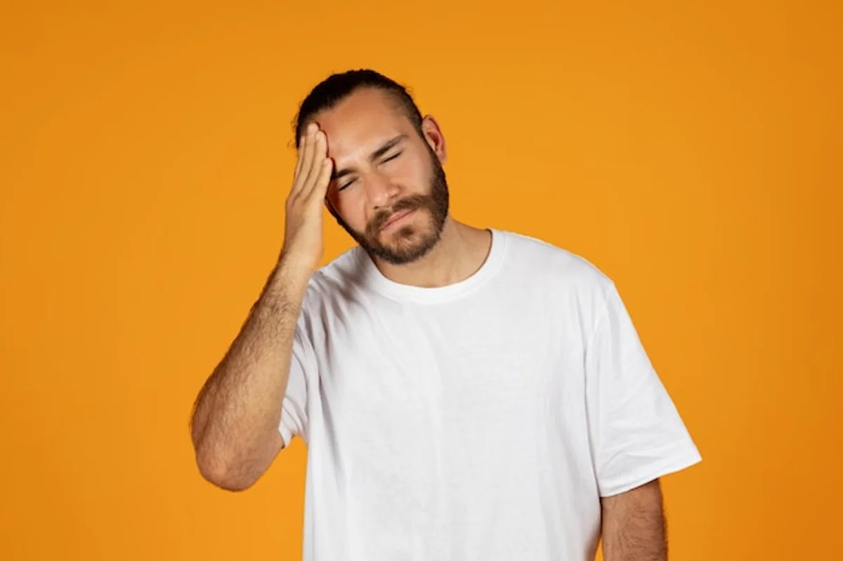 stressed man headache health risks Europe
