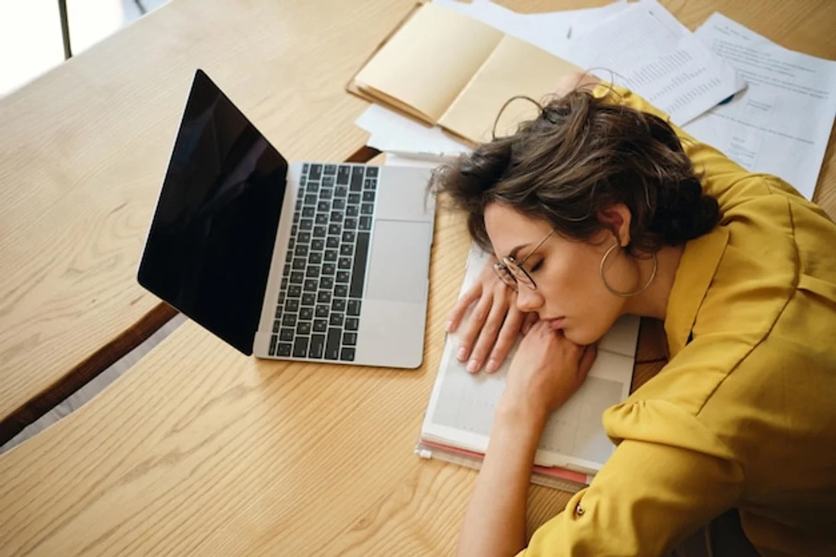 woman feeling tired at work during autumn